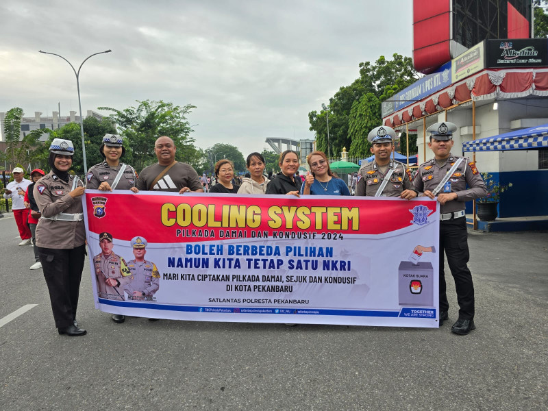 Wujudkan Pilkada Damai 2024, Satlantas Polresta Pekanbaru Gelar Cooling System Di Area Car Free Day