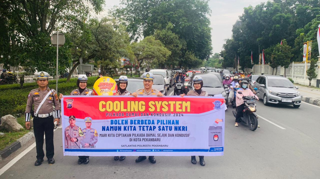 Satlantas Polresta Pekanbaru Gelar Cooling System di Tugu Zapin