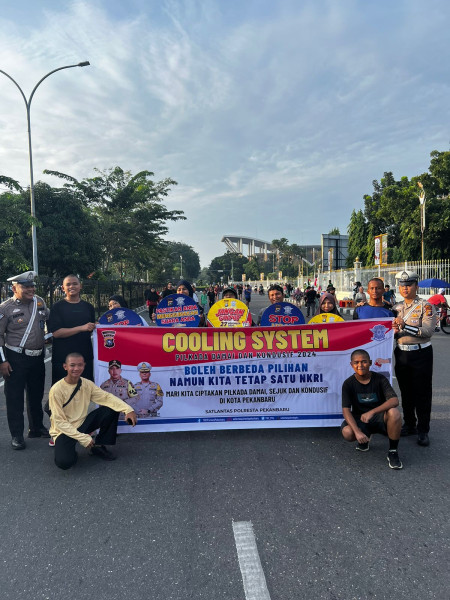 Demi Wujudkan Pilkada Damai 2024, Satlantas Polresta Pekanbaru Gelar Cooling System Di Lokasi Car Free Day (CFD)